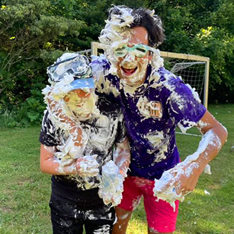 Students covered in shaving cream at TVR retreat